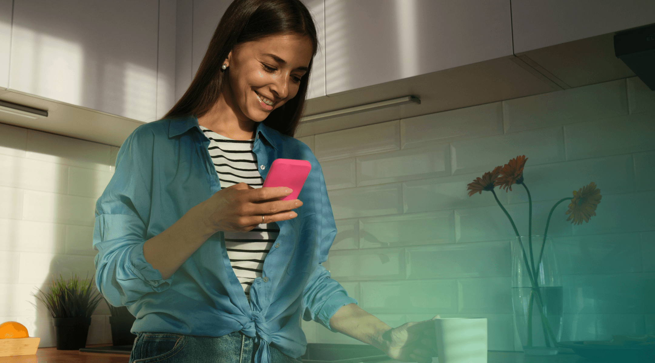 Woman smiling while using her phone